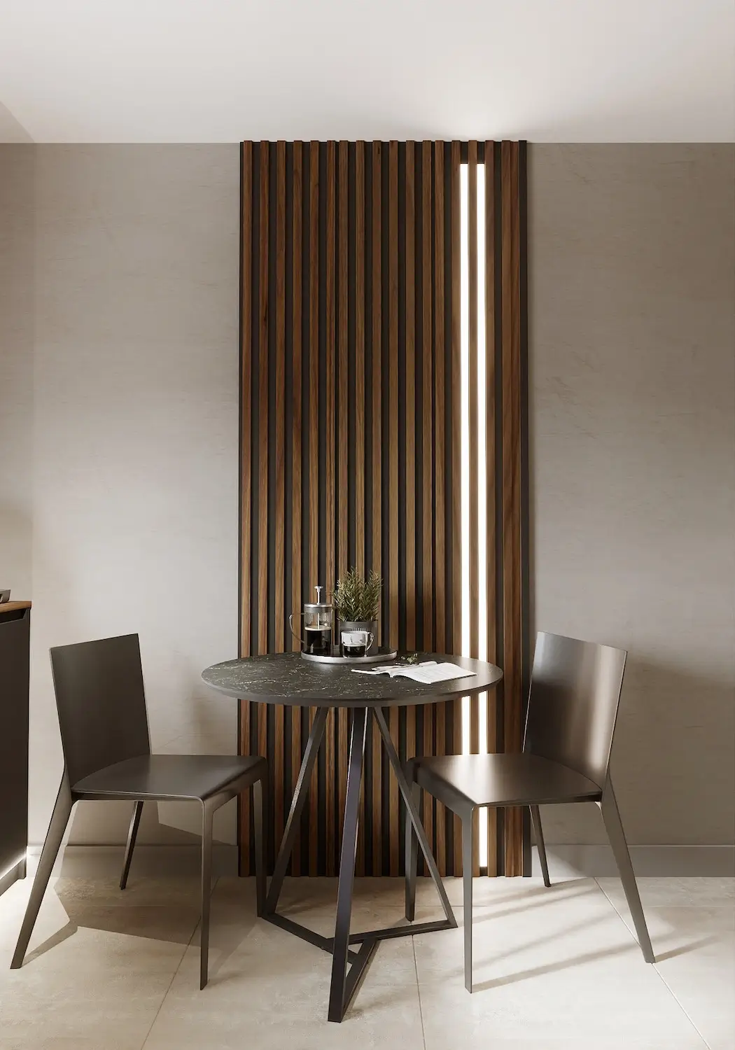 A small table with two chairs against a wall with wooden slats and vertical lighting